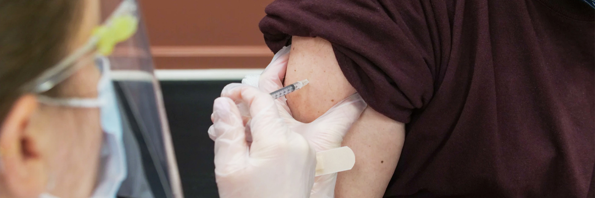 Image of needle about to be injected in arm