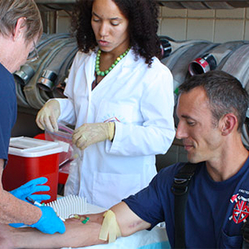 firefighter getting blood drawn